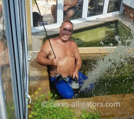 Emptying Alligator pond and watering the plants at the same time